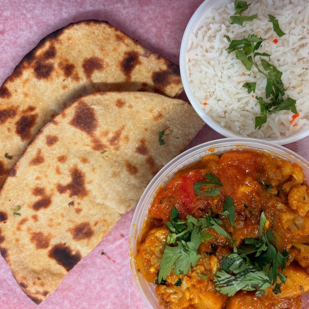 Tandoori roti with aloo gobi curry and steamed rice